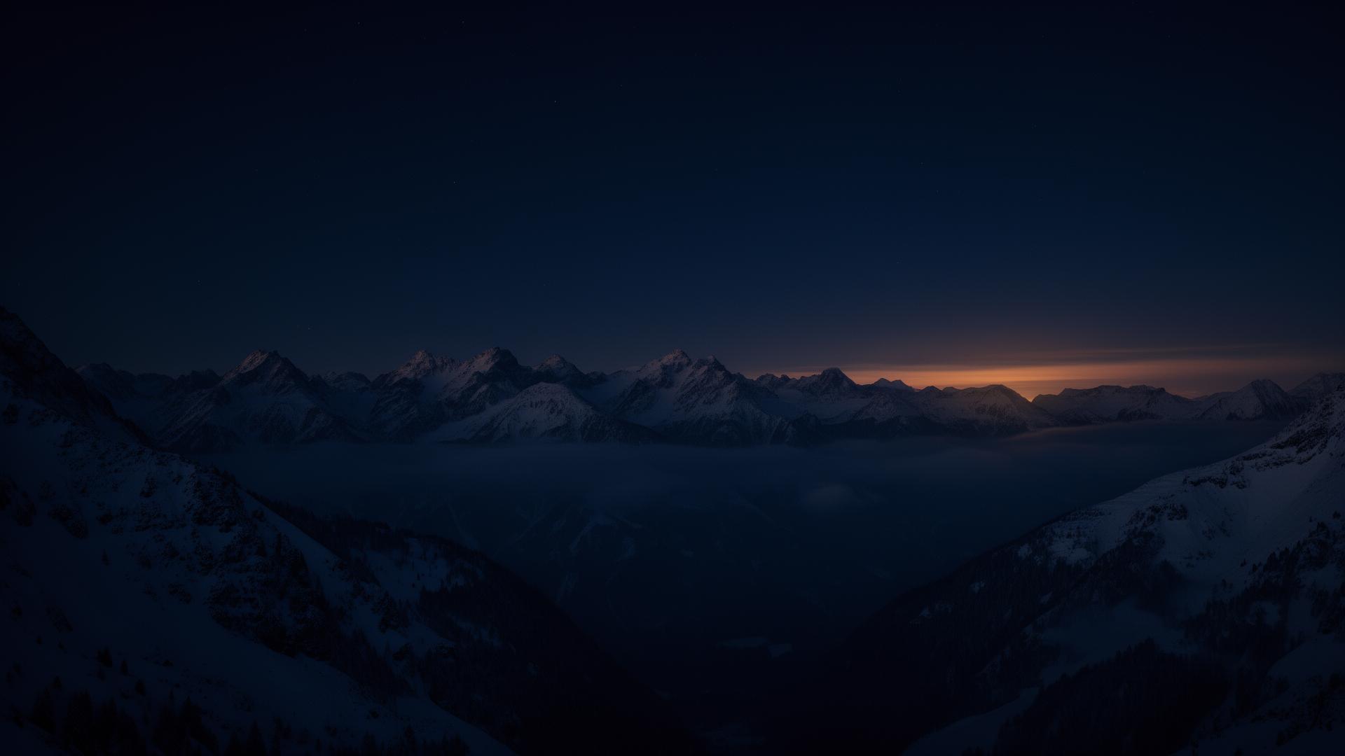 Snow-capped mountain range at twilight